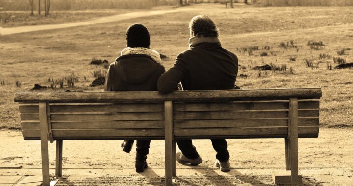 two people on bench
